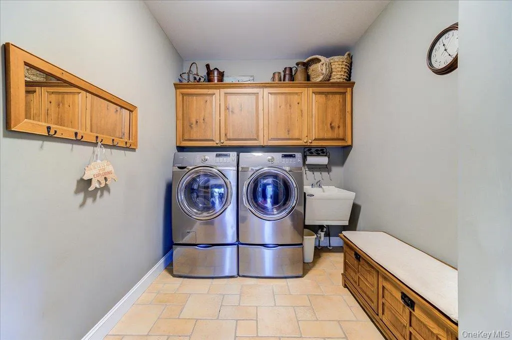 Enter from the two car garage to this convenient and functional laundry room/mud room area just steps from the kitchen. Enter from the two car garage to this convenient and functional laundry room/mud room area just steps from the kitchen.
