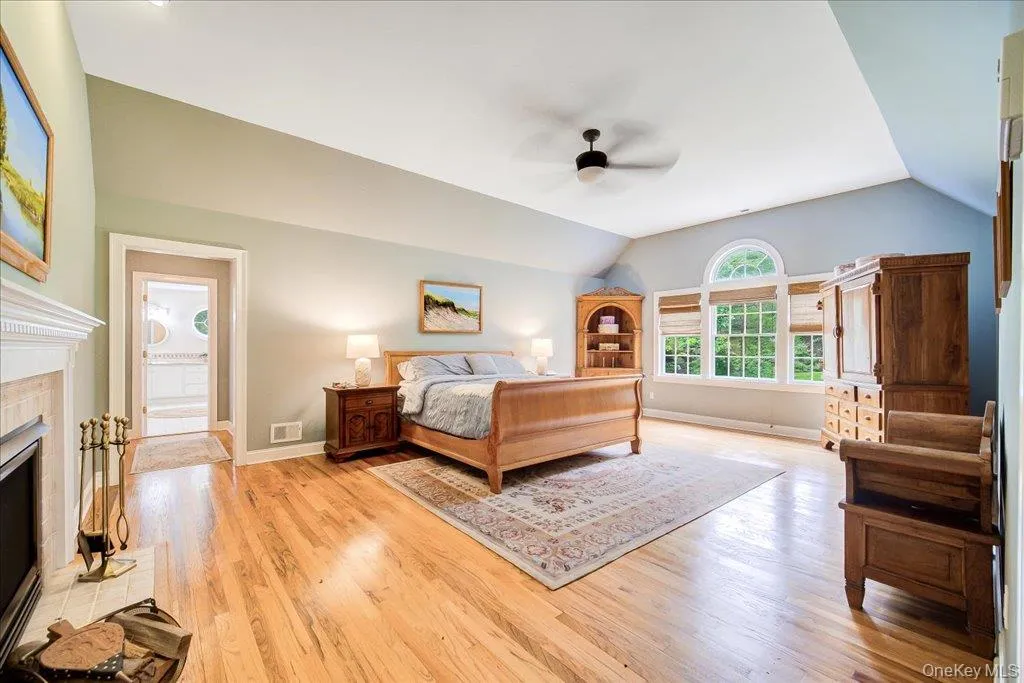 This luxury primary bedroom has a tray ceiling and cozy gas fireplace for chilly evenings. This luxury primary bedroom has a tray ceiling and cozy gas fireplace for chilly evenings.