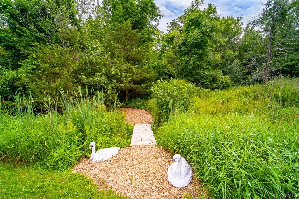 Wonderful wood-chipped paths wind through your private enchanted woodland forest in the very back of your property. Wonderful wood-chipped paths wind through your private enchanted woodland forest in the very back of your property.