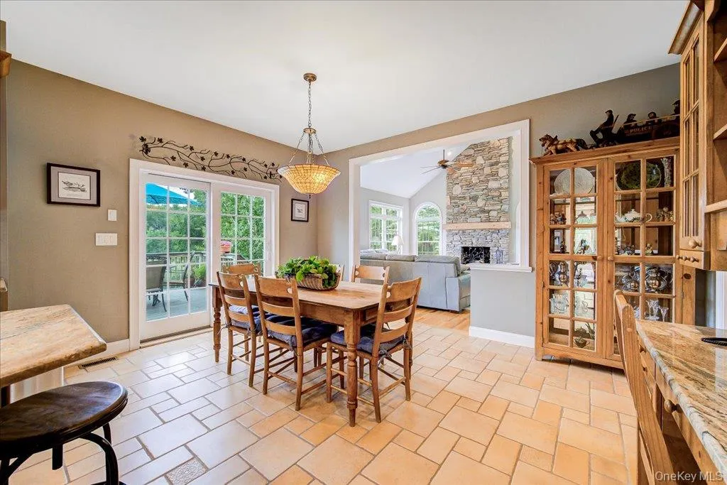 A large eat-in kitchen with plenty of room for a large table steps from the living room and sliders out to the large back deck. A large eat-in kitchen with plenty of room for a large table steps from the living room and sliders out to the large back deck.