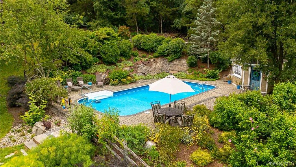 Enjoy summers and warm evenings poolside in your private garden oasis! Lush gardens and landscaping throughout make this a stunning setting to enjoy! Enjoy summers and warm evenings poolside in your private garden oasis! Lush gardens and landscaping throughout make this a stunning setting to enjoy!