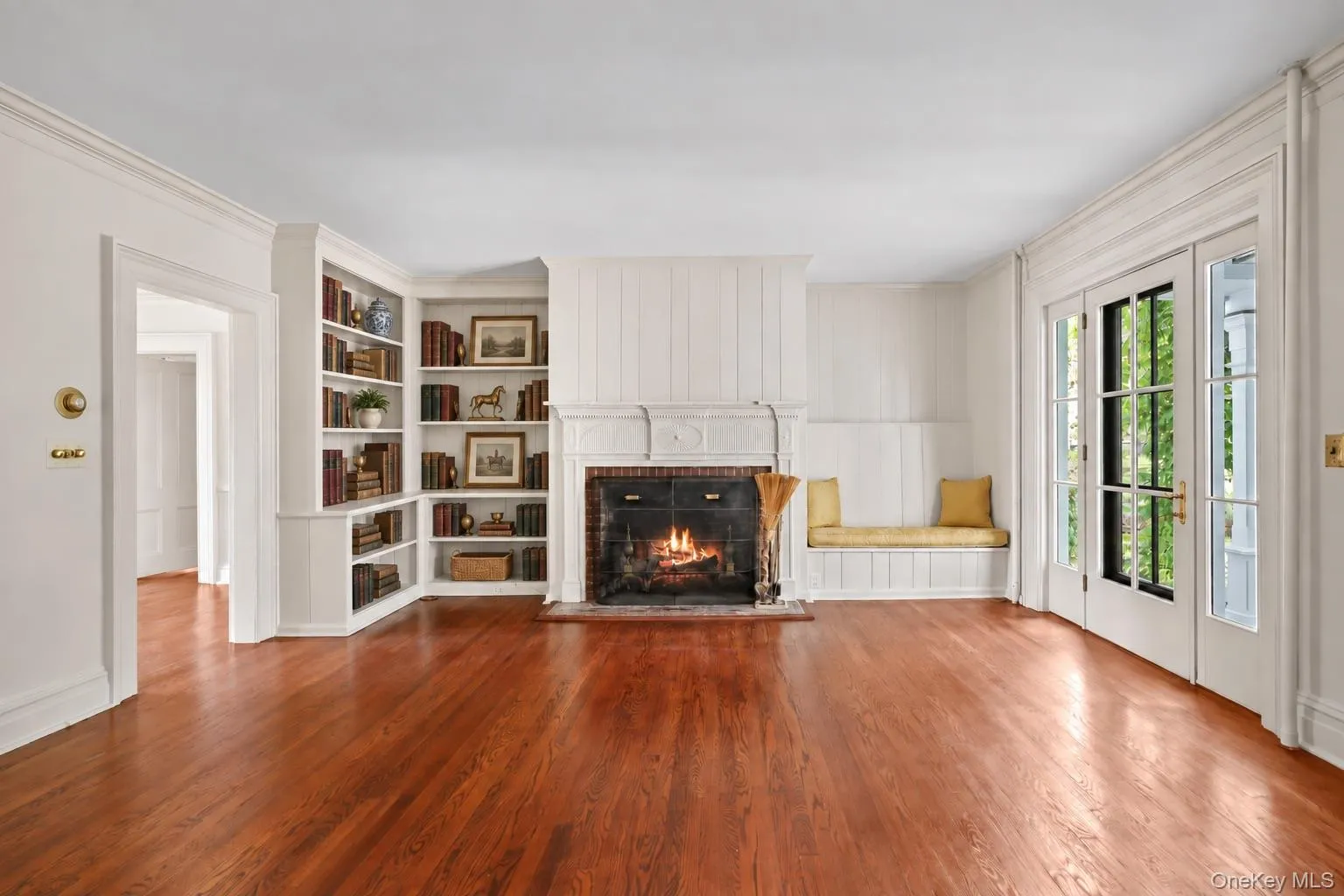 Expansive Living Room with Wood Burning Fireplace and Built-Ins Expansive Living Room with Wood Burning Fireplace and Built-Ins
