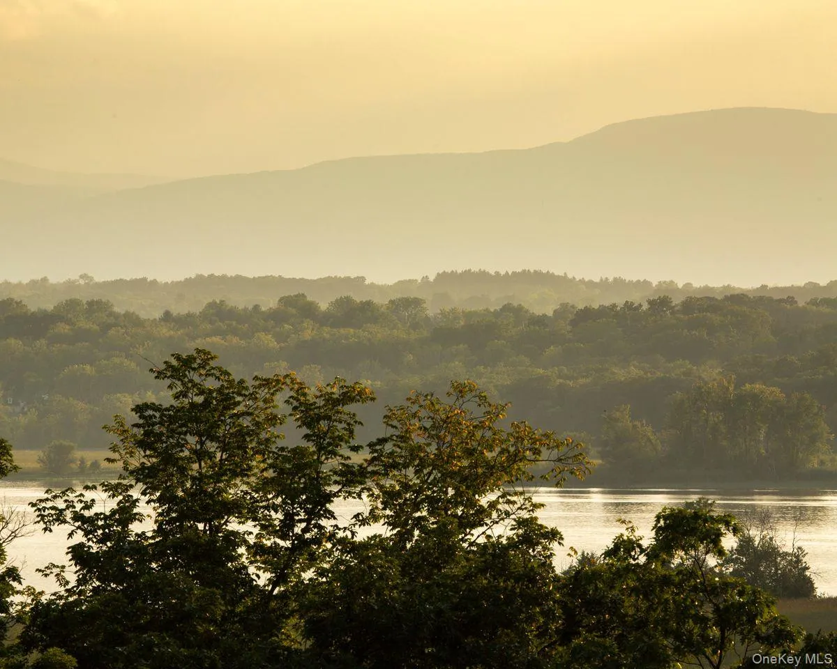 Property view of mountains with a water view and a forest view Property view of mountains with a water view and a forest view