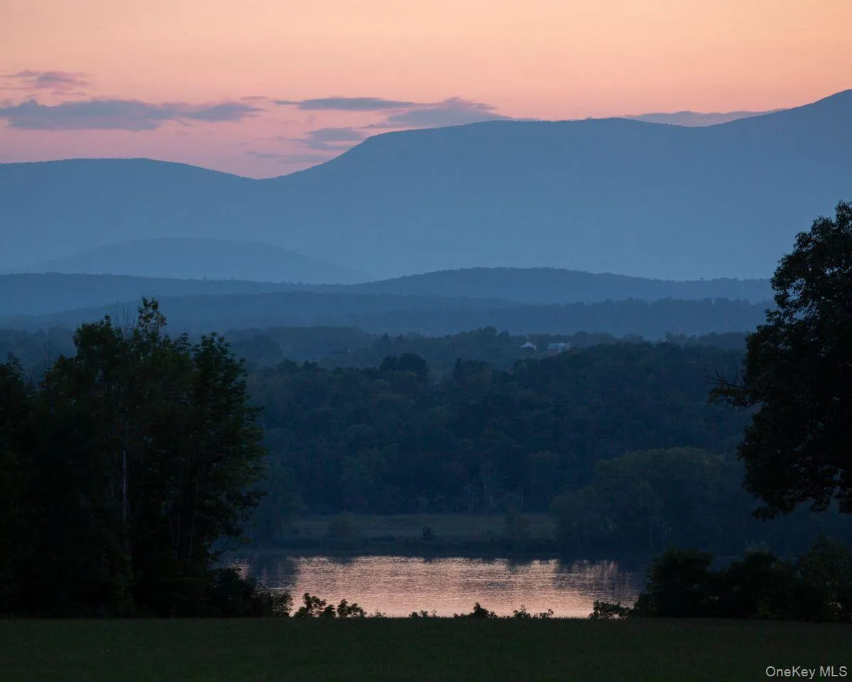 Property view of mountains featuring a water view and a forest view Property view of mountains featuring a water view and a forest view