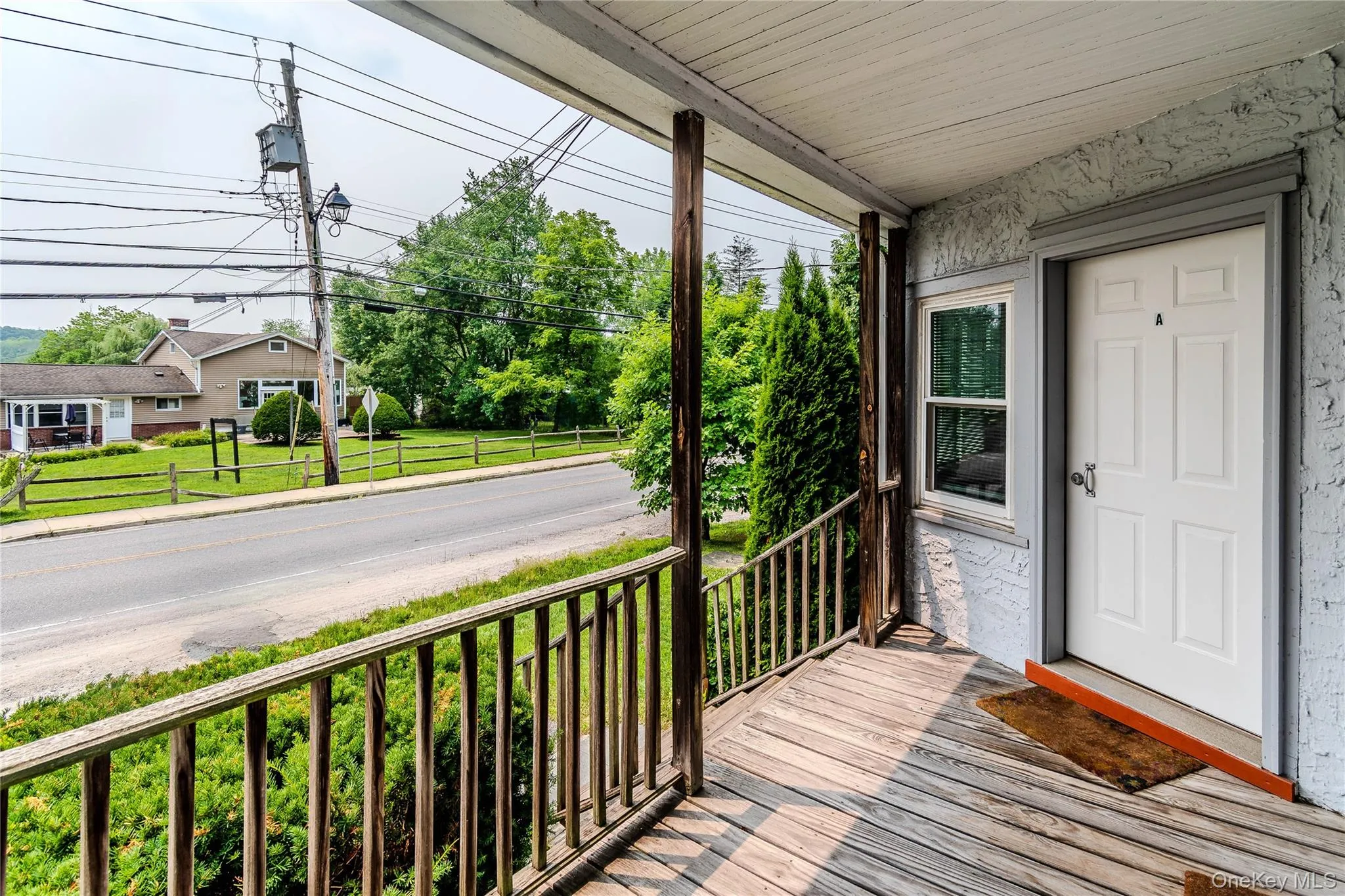 View of porch and entrance of a one bedroom with flexibility for guests, extended family, a home office, or other possible uses View of porch and entrance of a one bedroom with flexibility for guests, extended family, a home office, or other possible uses
