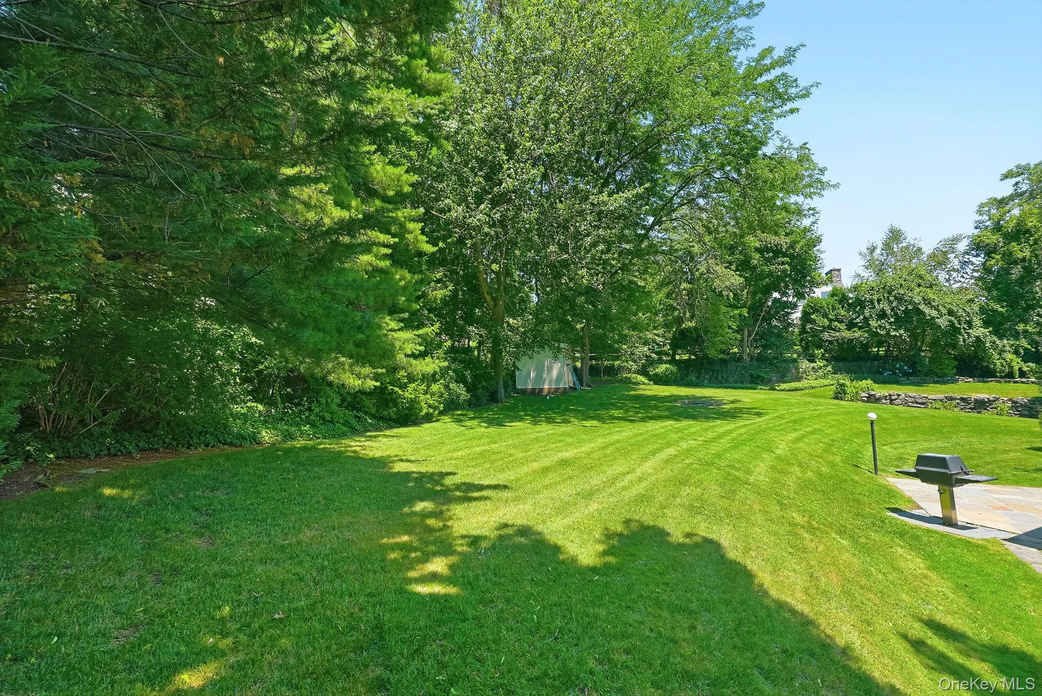 Long view across the backyard of this .45 acre haven Long view across the backyard of this .45 acre haven