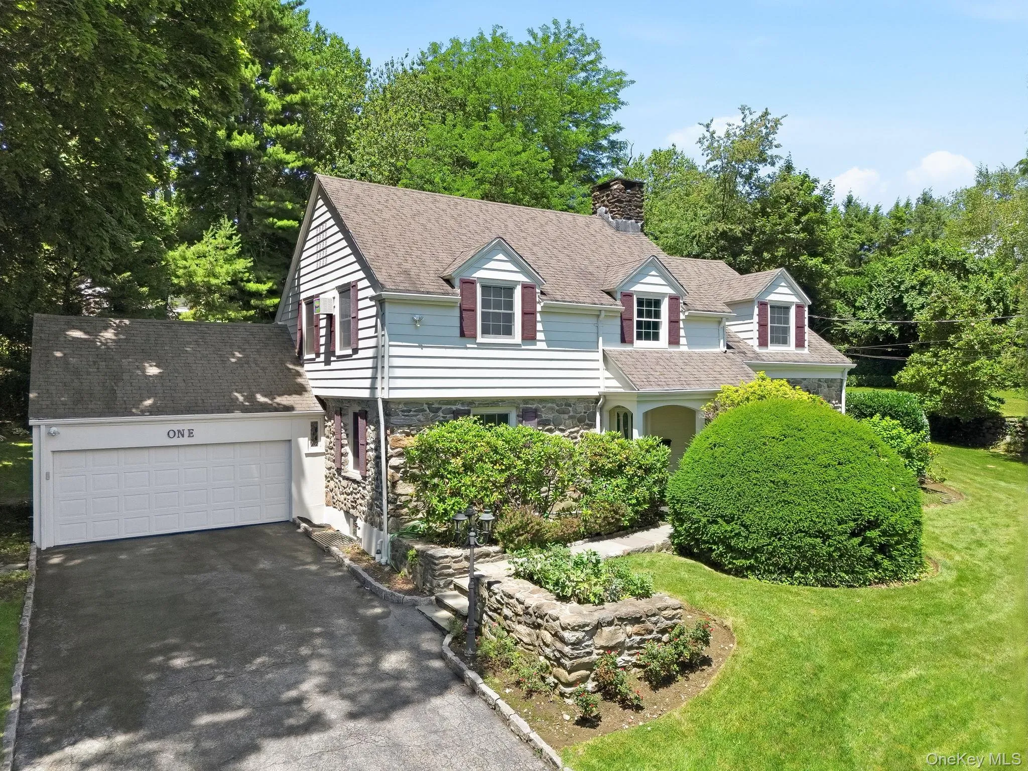Aerial view of charming facade showing convenient attached garage Aerial view of charming facade showing convenient attached garage
