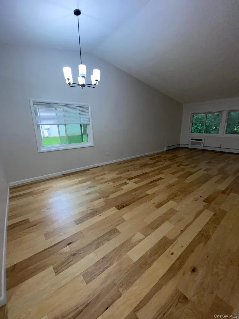 Huge open living room opens to dining area Huge open living room opens to dining area