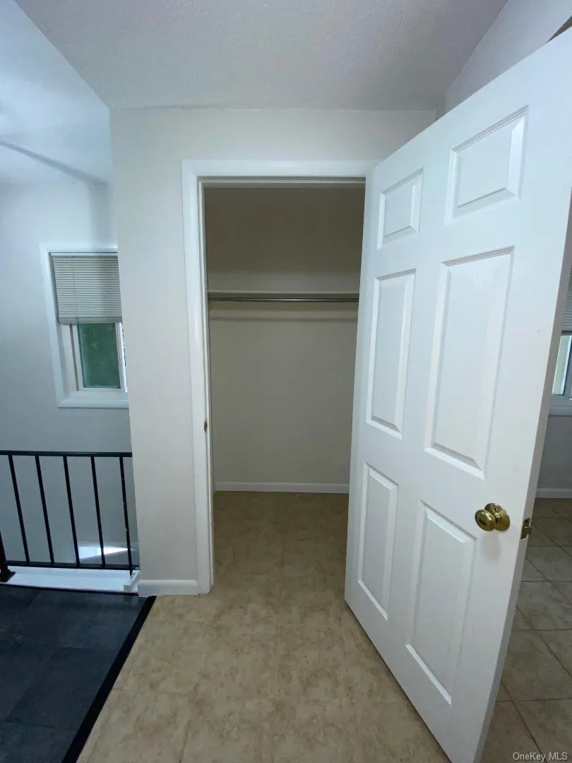 Good size clothes closet with a storage shelf above. Good size clothes closet with a storage shelf above.