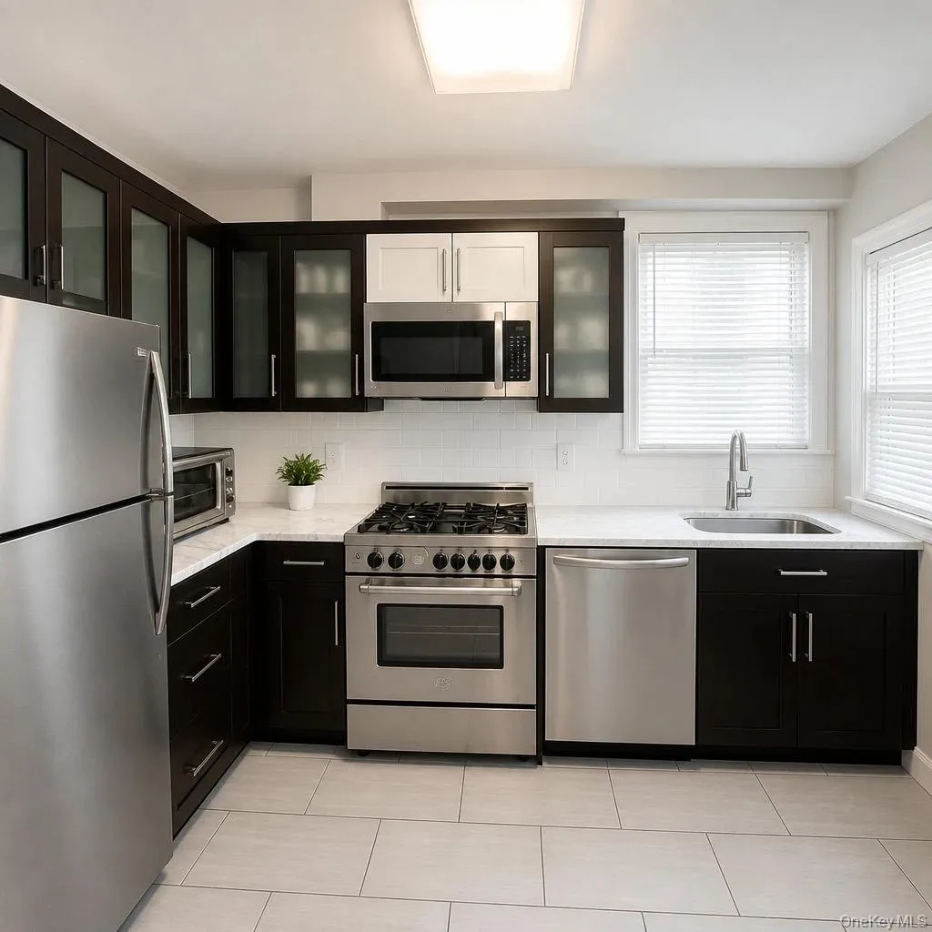 Kitchen featuring stainless steel appliances, white subway tile backsplash, light-toned countertop, dark wood-finish cabinetry, and light-toned tile flooring Kitchen featuring stainless steel appliances, white subway tile backsplash, light-toned countertop, dark wood-finish cabinetry, and light-toned tile flooring