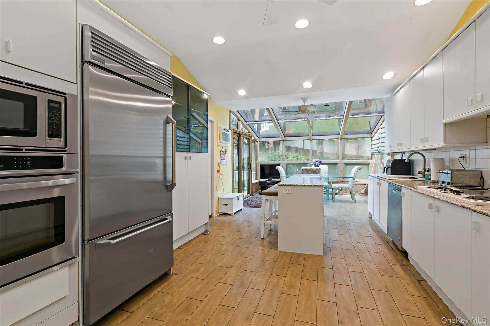 Large Eat-in Kitchen with Sliders to Outside and door to Formal DR Large Eat-in Kitchen with Sliders to Outside and door to Formal DR