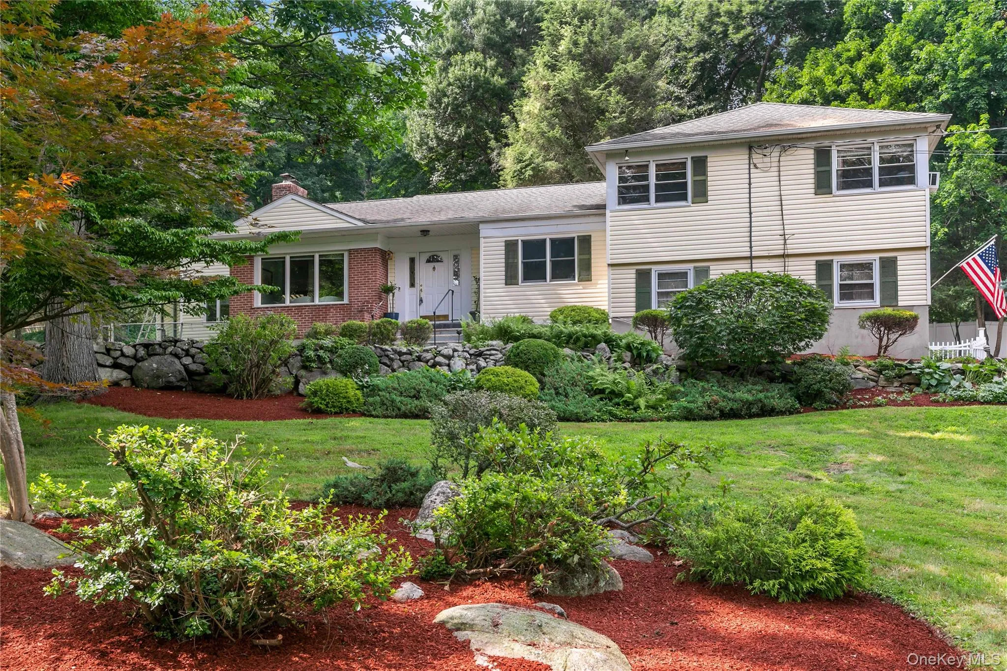 Front of home with beautiful professionally landscaped property Front of home with beautiful professionally landscaped property