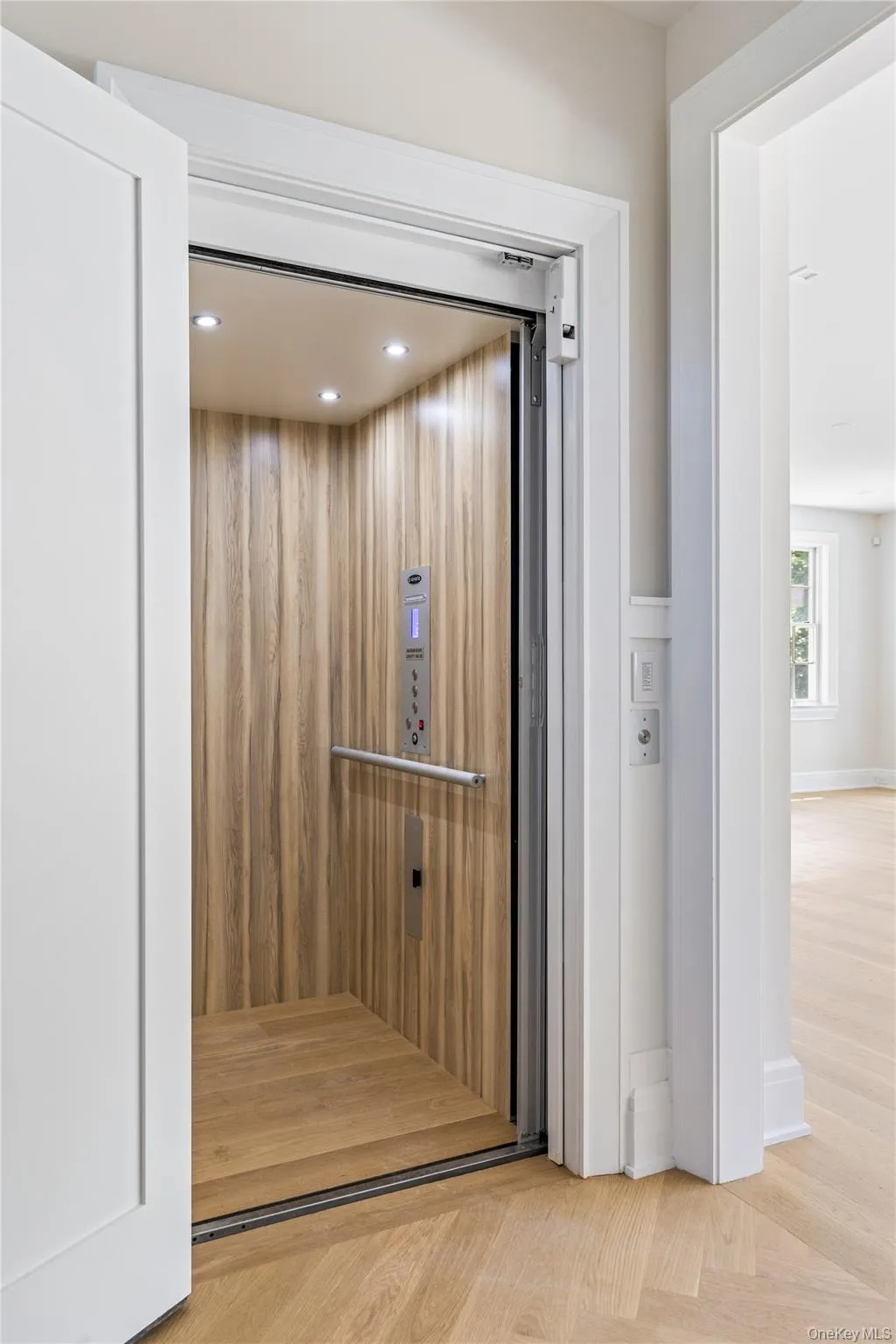 A private wood-paneled elevator provides effortless access to all three levels of this thoughtfully designed residence. A private wood-paneled elevator provides effortless access to all three levels of this thoughtfully designed residence.