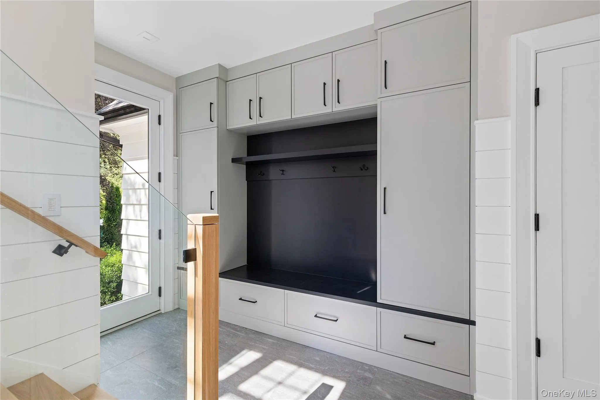 The custom mudroom offers built-in seating, abundant storage, and a practical everyday drop zone designed to keep life beautifully organized. The custom mudroom offers built-in seating, abundant storage, and a practical everyday drop zone designed to keep life beautifully organized.