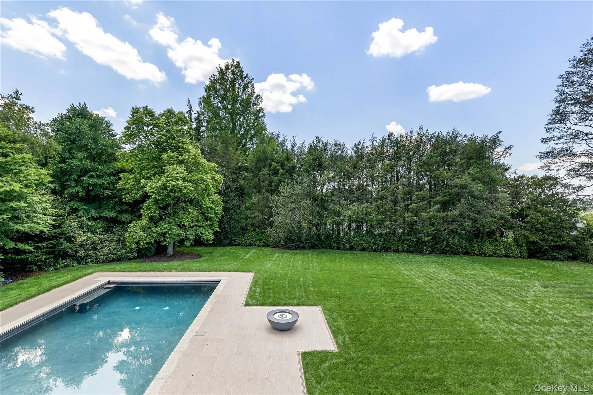 Level, beautifully landscaped grounds provide exceptional privacy and abundant space for recreation, entertaining, or simply enjoying the outdoors. Level, beautifully landscaped grounds provide exceptional privacy and abundant space for recreation, entertaining, or simply enjoying the outdoors.