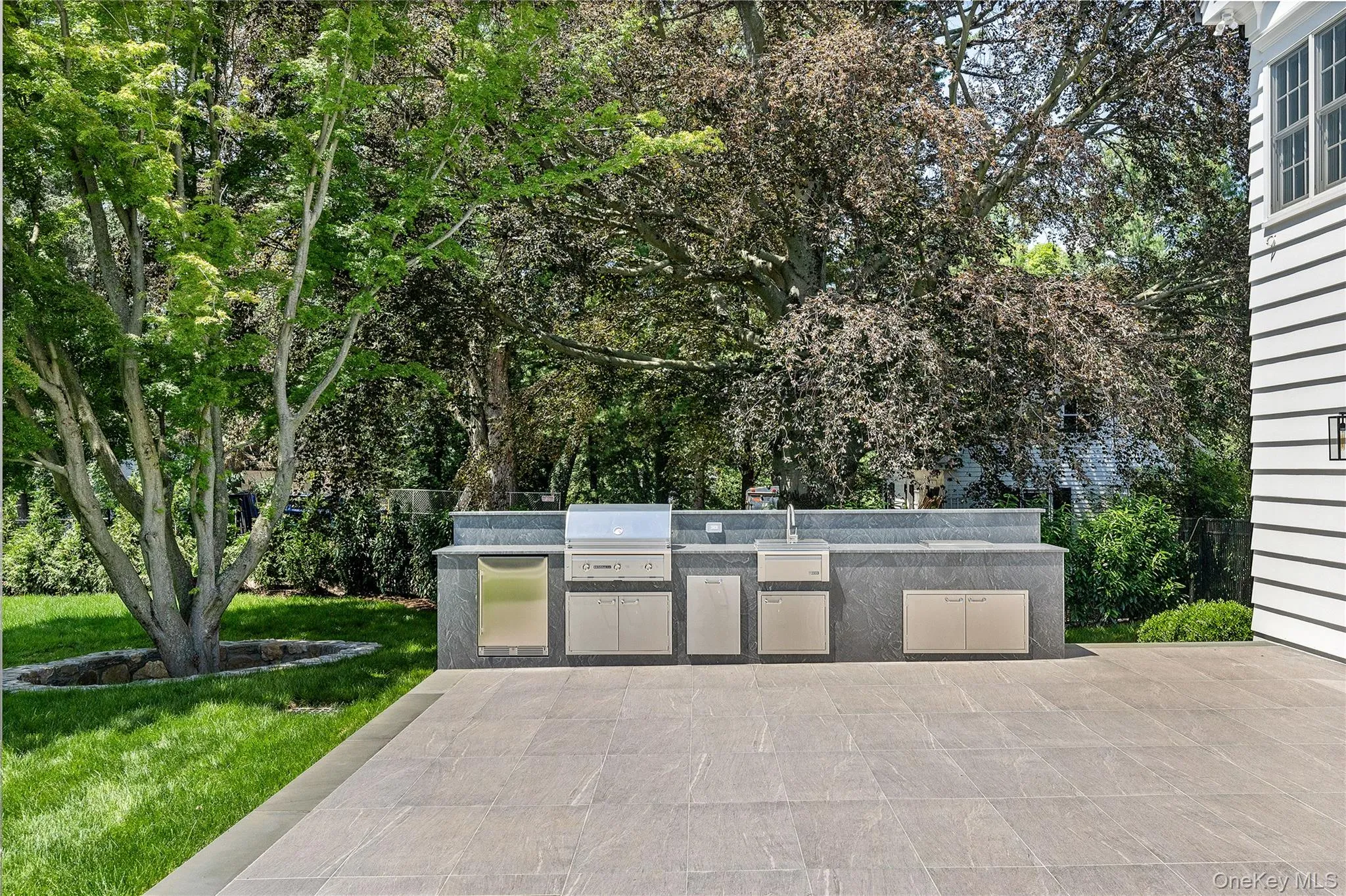 Resort-inspired outdoor amenities include expansive patios, and beautifully designed spaces for relaxing or entertaining including this fully equipped outdoor kitchen. Resort-inspired outdoor amenities include expansive patios, and beautifully designed spaces for relaxing or entertaining including this fully equipped outdoor kitchen.