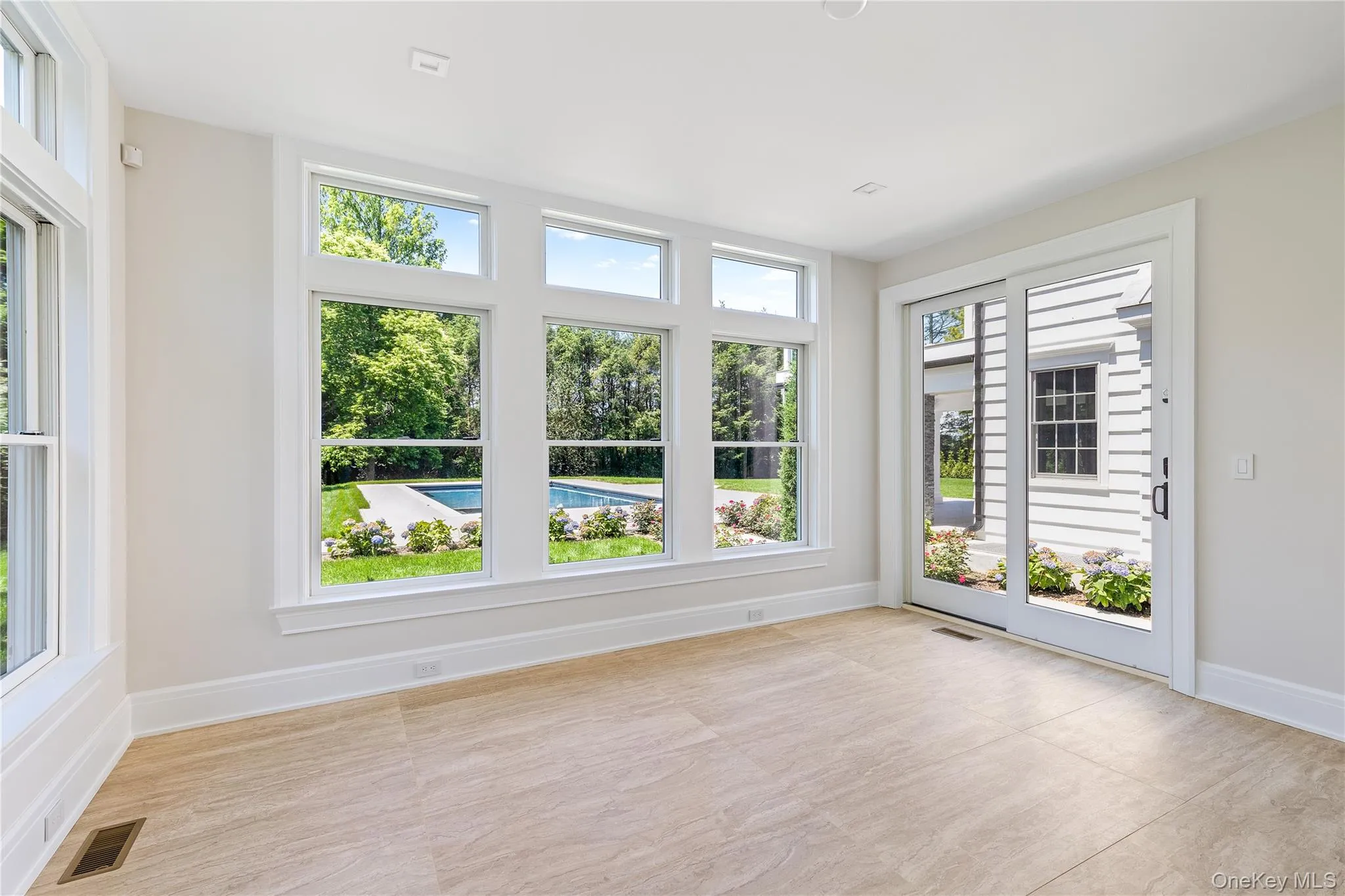 A versatile sun-filled room overlooking the backyard is ideal as a fitness studio, yoga room, lounge, guest suite, creative space, or additional work-from-home office. A versatile sun-filled room overlooking the backyard is ideal as a fitness studio, yoga room, lounge, guest suite, creative space, or additional work-from-home office.