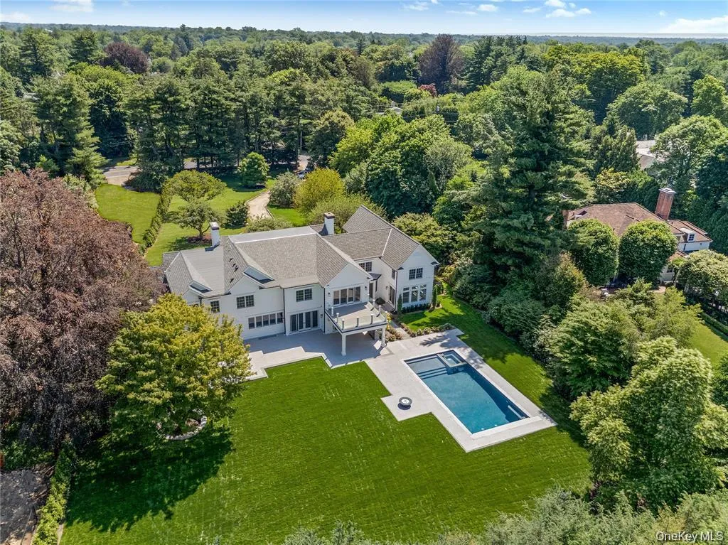 From above, the exceptional scale of the property is on full display, with generous level lawns, resort-caliber amenities, and outstanding privacy in one of Scarsdale's most coveted neighborhoods. From above, the exceptional scale of the property is on full display, with generous level lawns, resort-caliber amenities, and outstanding privacy in one of Scarsdale's most coveted neighborhoods.