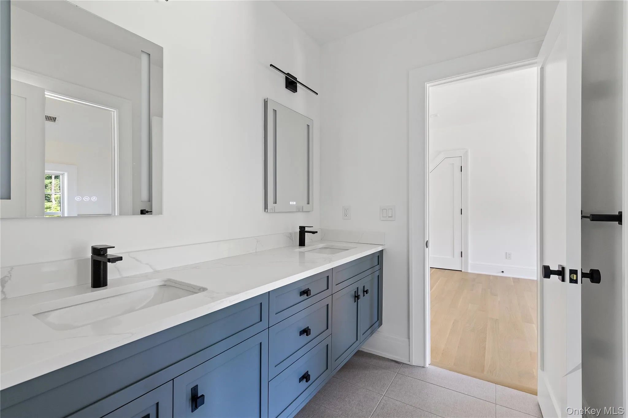 Designer details continue throughout the second level, where stylish ensuite baths provide both comfort and convenience for family and guests. This is the second of four ensuite guest baths on this level. Designer details continue throughout the second level, where stylish ensuite baths provide both comfort and convenience for family and guests. This is the second of four ensuite guest baths on this level.