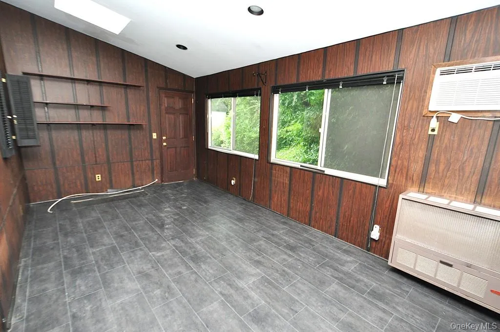 The enclosed back porch has two sky lights, a door leading to the back yard, pass thru to the kitchen and sliding doors leading to the dining room. The room is approx 17'-7" x 10'-0". The enclosed back porch has two sky lights, a door leading to the back yard, pass thru to the kitchen and sliding doors leading to the dining room. The room is approx 17'-7" x 10'-0".