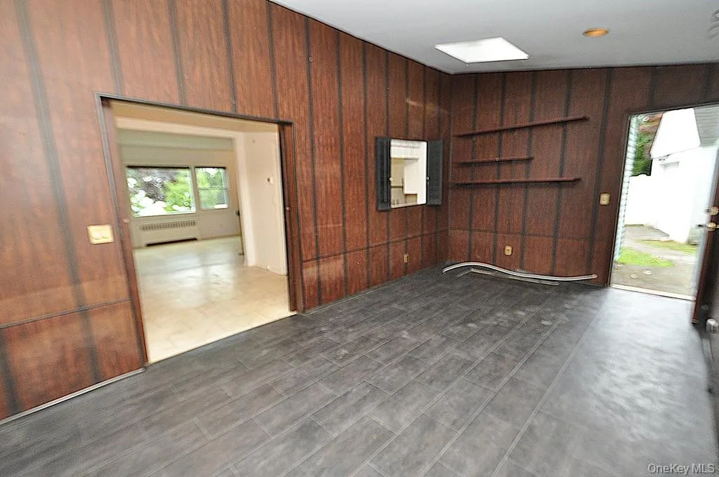 The enclosed back porch has two sky lights, a door leading to the back yard, pass thru to the kitchen and sliding doors leading to the dining room. The room is approx 17'-7" x 10'-0". The enclosed back porch has two sky lights, a door leading to the back yard, pass thru to the kitchen and sliding doors leading to the dining room. The room is approx 17'-7" x 10'-0".