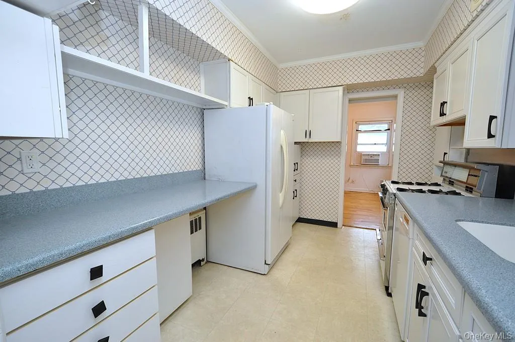 The kitchen has a pass thru to the family room and also a door leading to the utility room/laundry room and access to the back yard. The kitchen has a pass thru to the family room and also a door leading to the utility room/laundry room and access to the back yard.