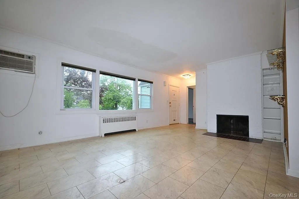 The living room has a large picture window, fireplace and opens to the dining room. The Living room is approx 22'-9" x 13'-1" and the dining area is 10'-2" x 8'-11". The living room has a large picture window, fireplace and opens to the dining room. The Living room is approx 22'-9" x 13'-1" and the dining area is 10'-2" x 8'-11".
