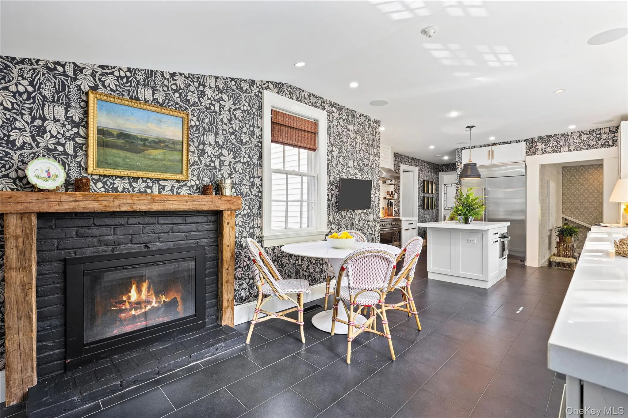 Another angle of the kitchen with fireplace Another angle of the kitchen with fireplace