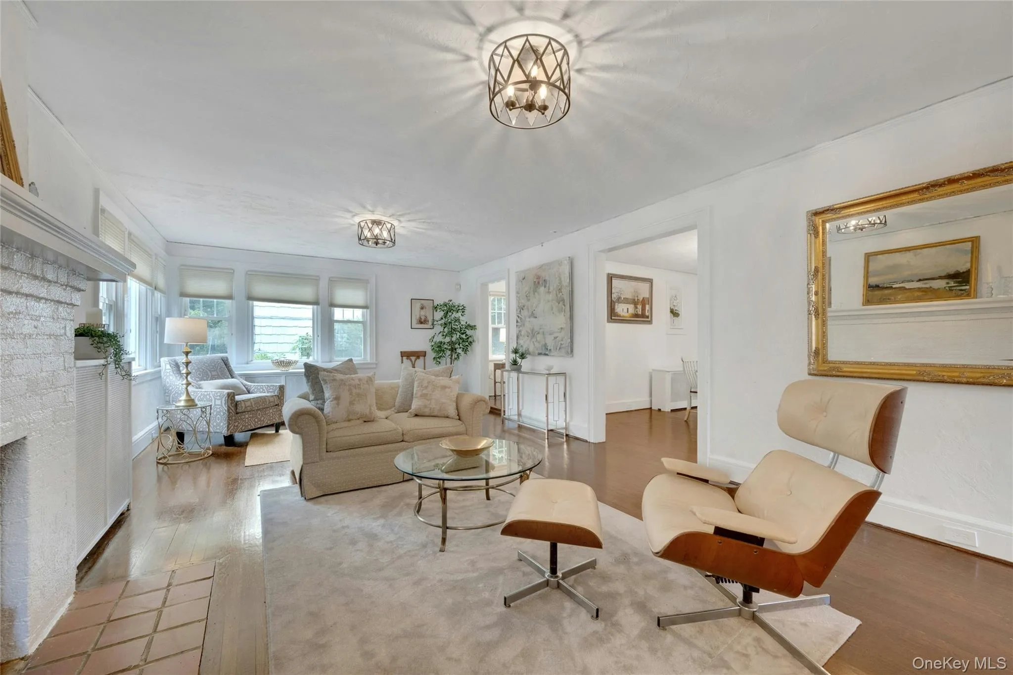 View of living room with views facing the front and side yard. Opens to the dining room and study. View of living room with views facing the front and side yard. Opens to the dining room and study.