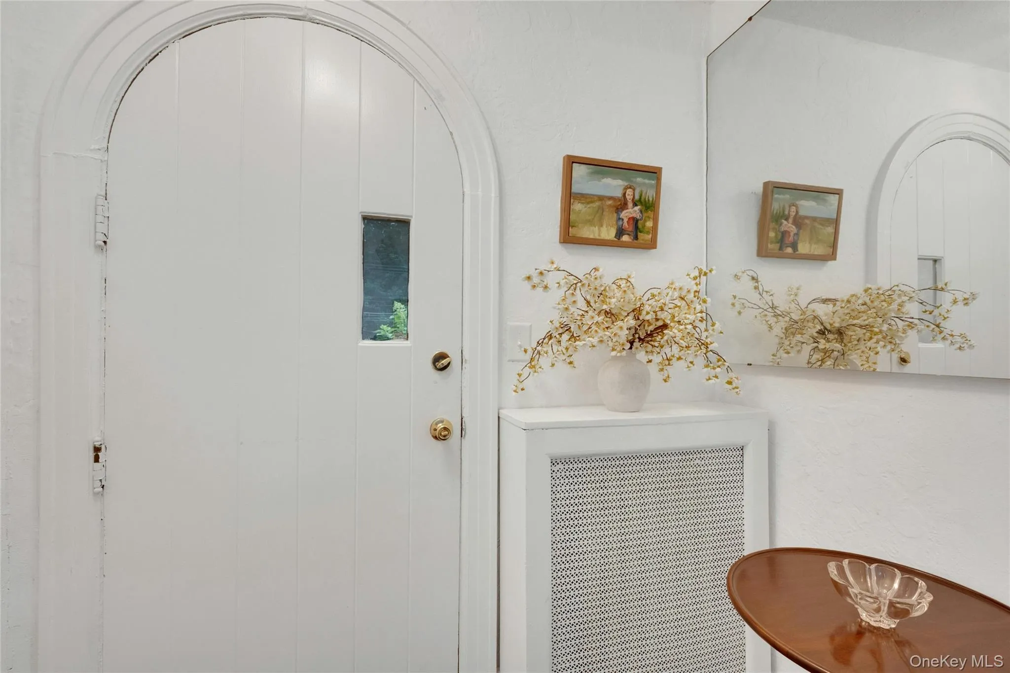 Front entry to the house with larger coat closet. Front entry to the house with larger coat closet.