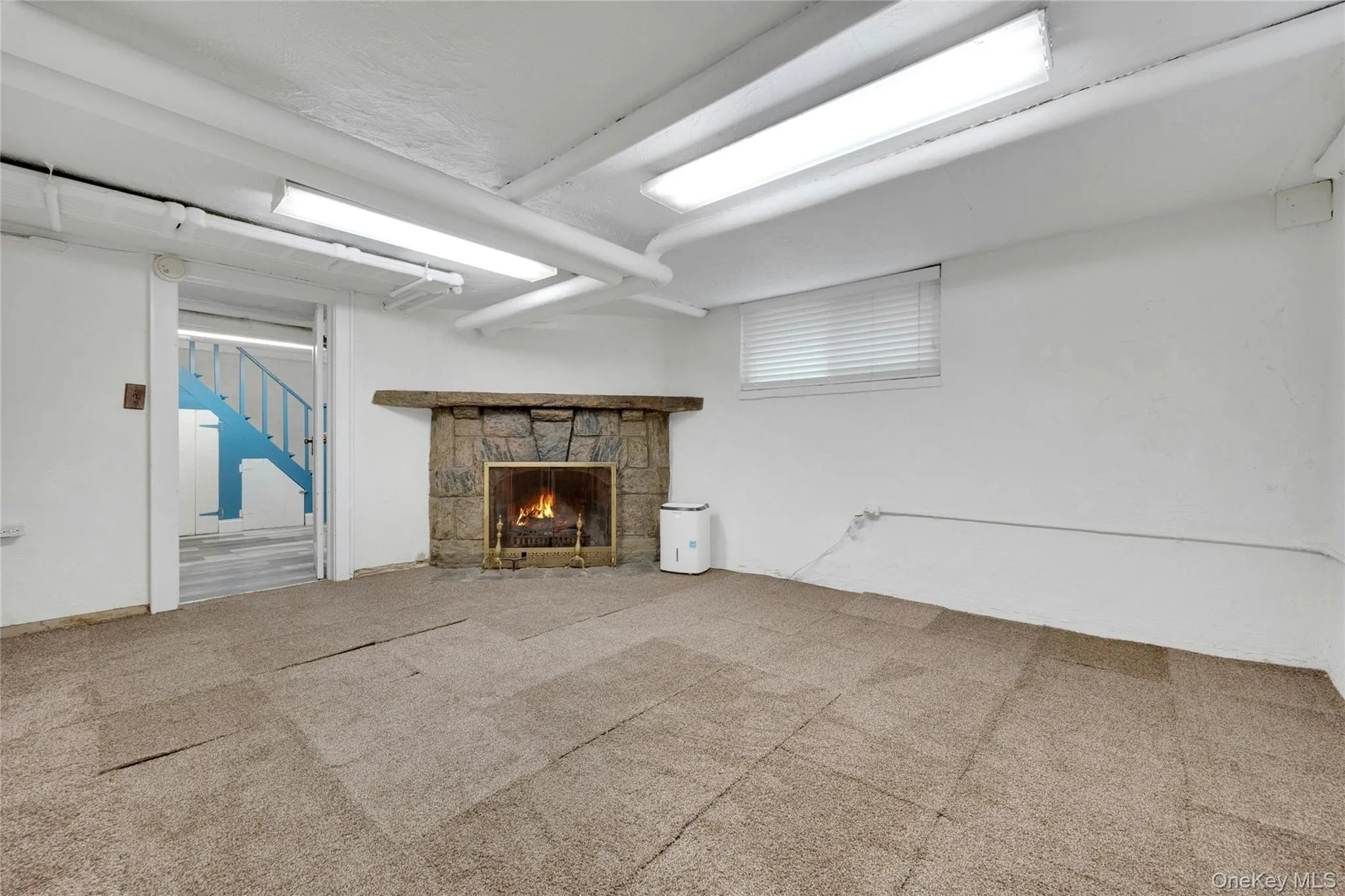 Lower level basement offers full bathroom, washer/dryer, and access to the attached garage. Lower level basement offers full bathroom, washer/dryer, and access to the attached garage.