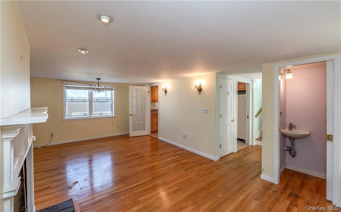 Unfurnished living room featuring light hardwood / wood-style flooring Unfurnished living room featuring light hardwood / wood-style flooring