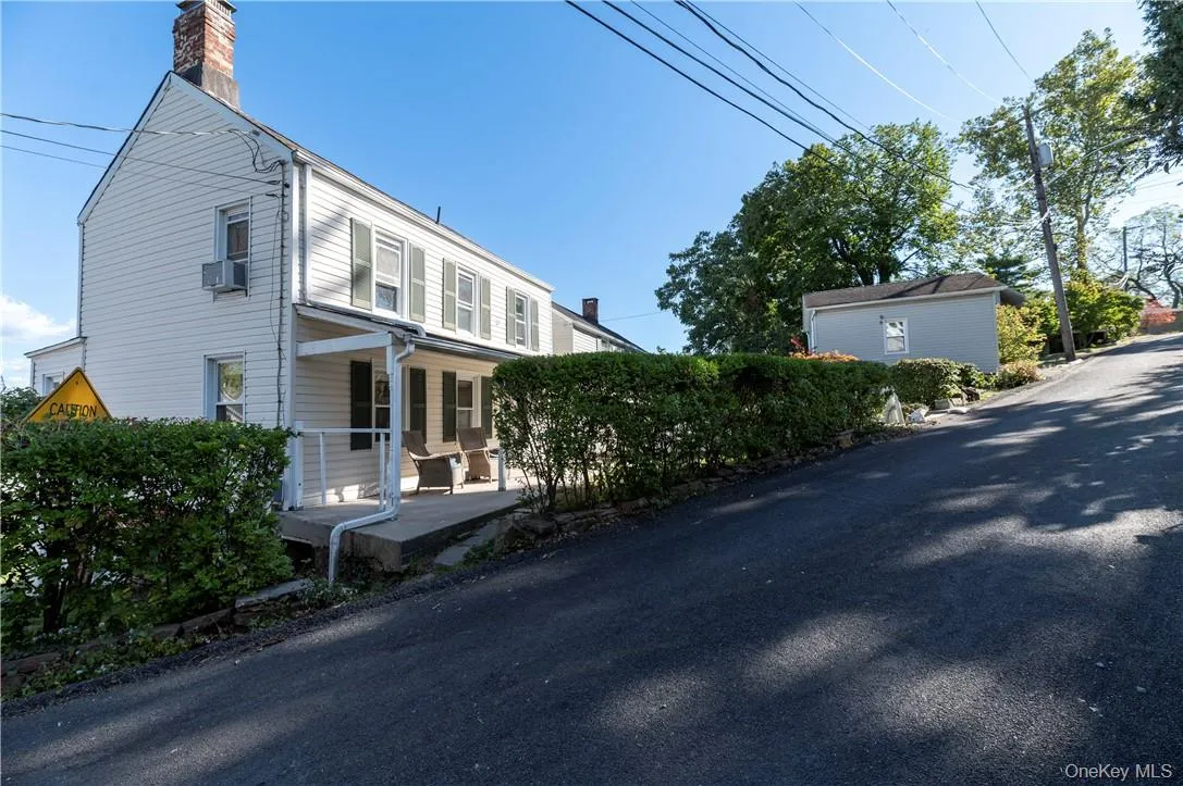 View of home's exterior with a porch View of home's exterior with a porch