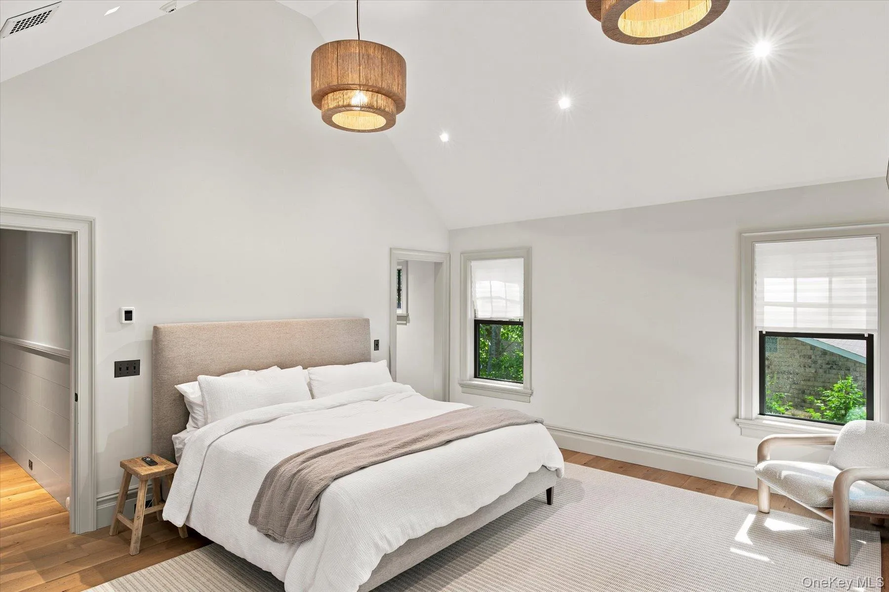 Vaulted ceiling featuring recessed lighting and two contemporary drum pendant fixtures Vaulted ceiling featuring recessed lighting and two contemporary drum pendant fixtures