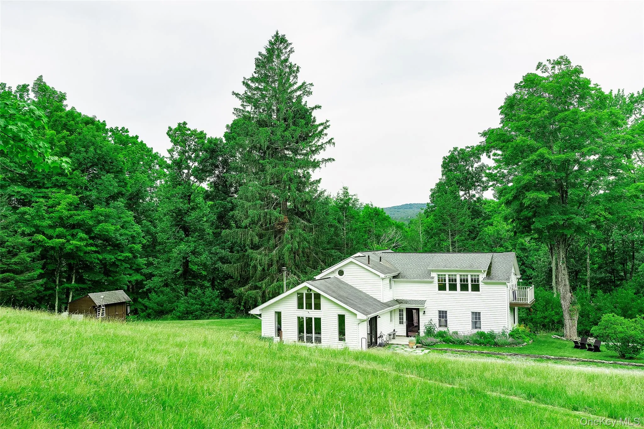 Principal view of this home from the hillside above sets the context in the woodlands in the foothills of the Catskill Mountains. Quiet, Secluded, Peaceful and beautiful. Principal view of this home from the hillside above sets the context in the woodlands in the foothills of the Catskill Mountains. Quiet, Secluded, Peaceful and beautiful.
