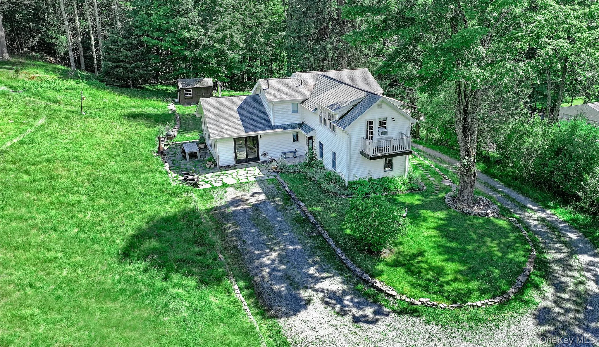 By circling the home the driveway brings you to the level, primary home entrance By circling the home the driveway brings you to the level, primary home entrance