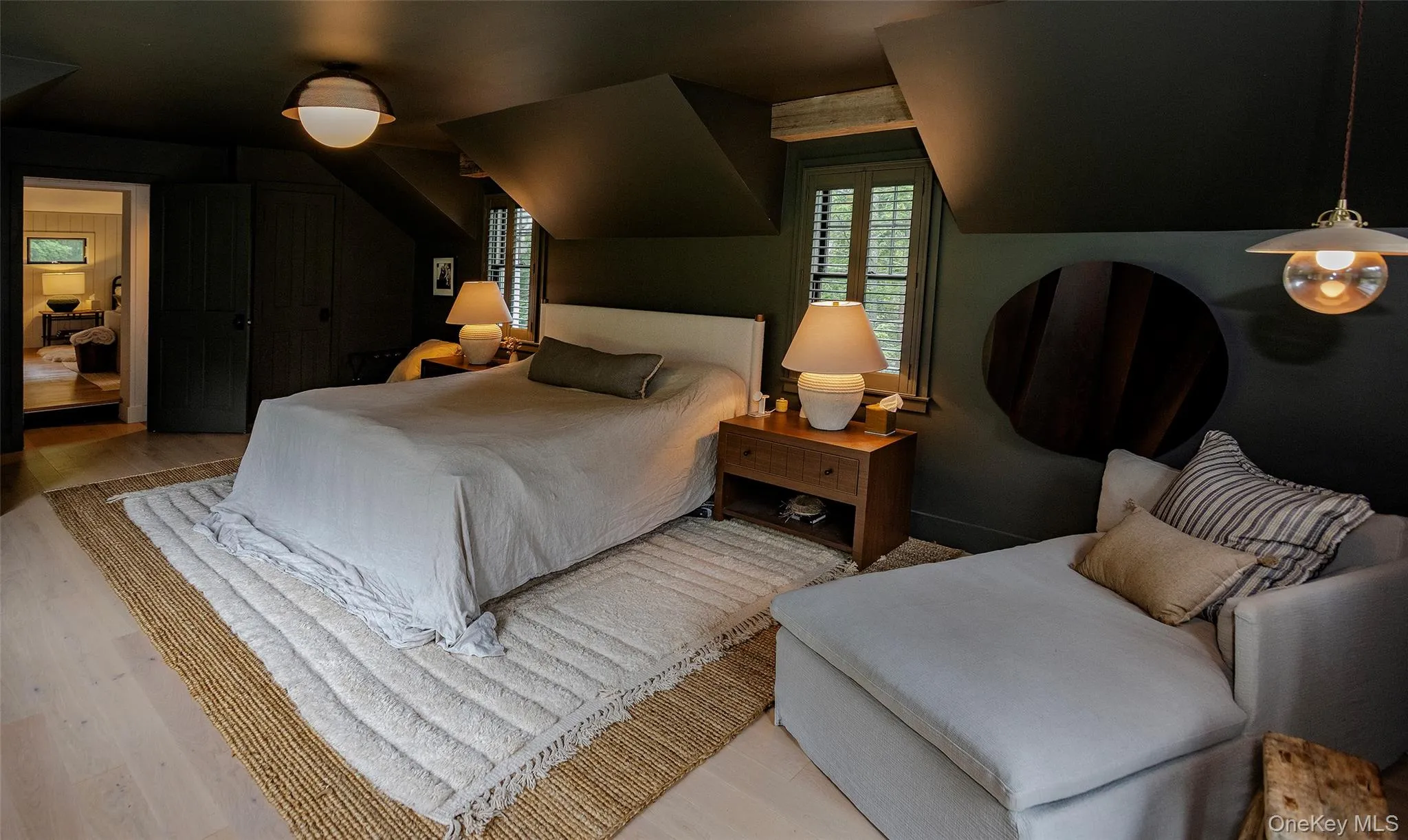 Large main bedroom with balcony and views of three sides of the house, the mountain the primary entrance and a quiet calming decor. Large main bedroom with balcony and views of three sides of the house, the mountain the primary entrance and a quiet calming decor.