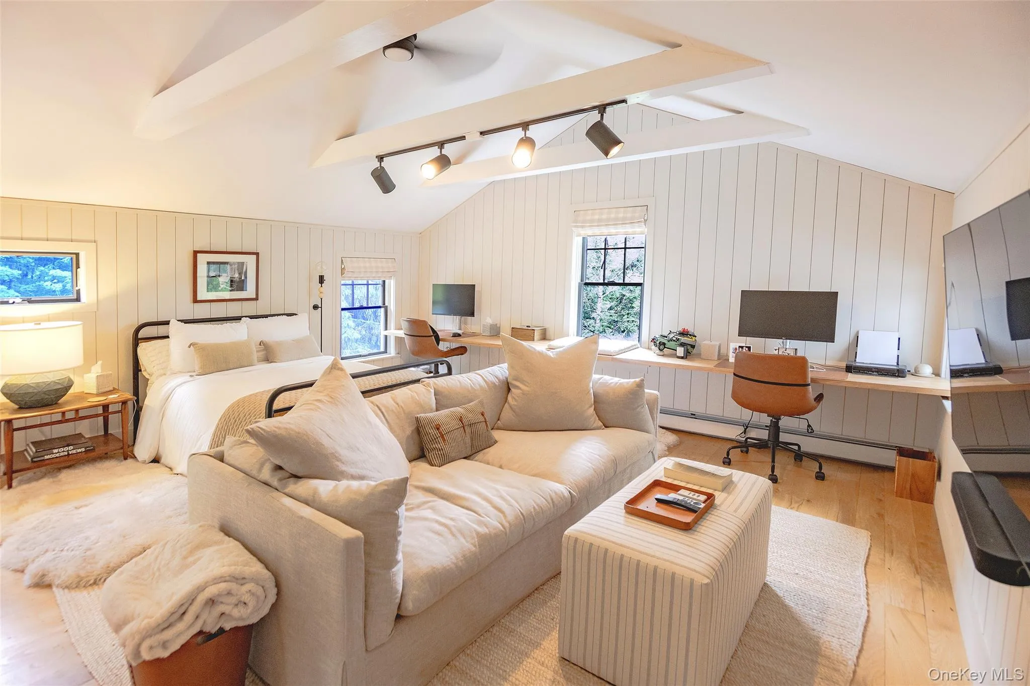 Large, combination media room, office/work room and bedroom with vaulted ceilings and views of the great room and three sides of the exterior. Large, combination media room, office/work room and bedroom with vaulted ceilings and views of the great room and three sides of the exterior.
