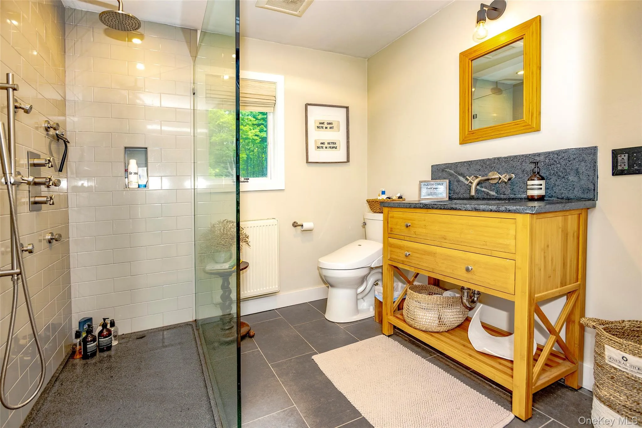 First floor bathroom with glass enclosed walk-in shower. First floor bathroom with glass enclosed walk-in shower.