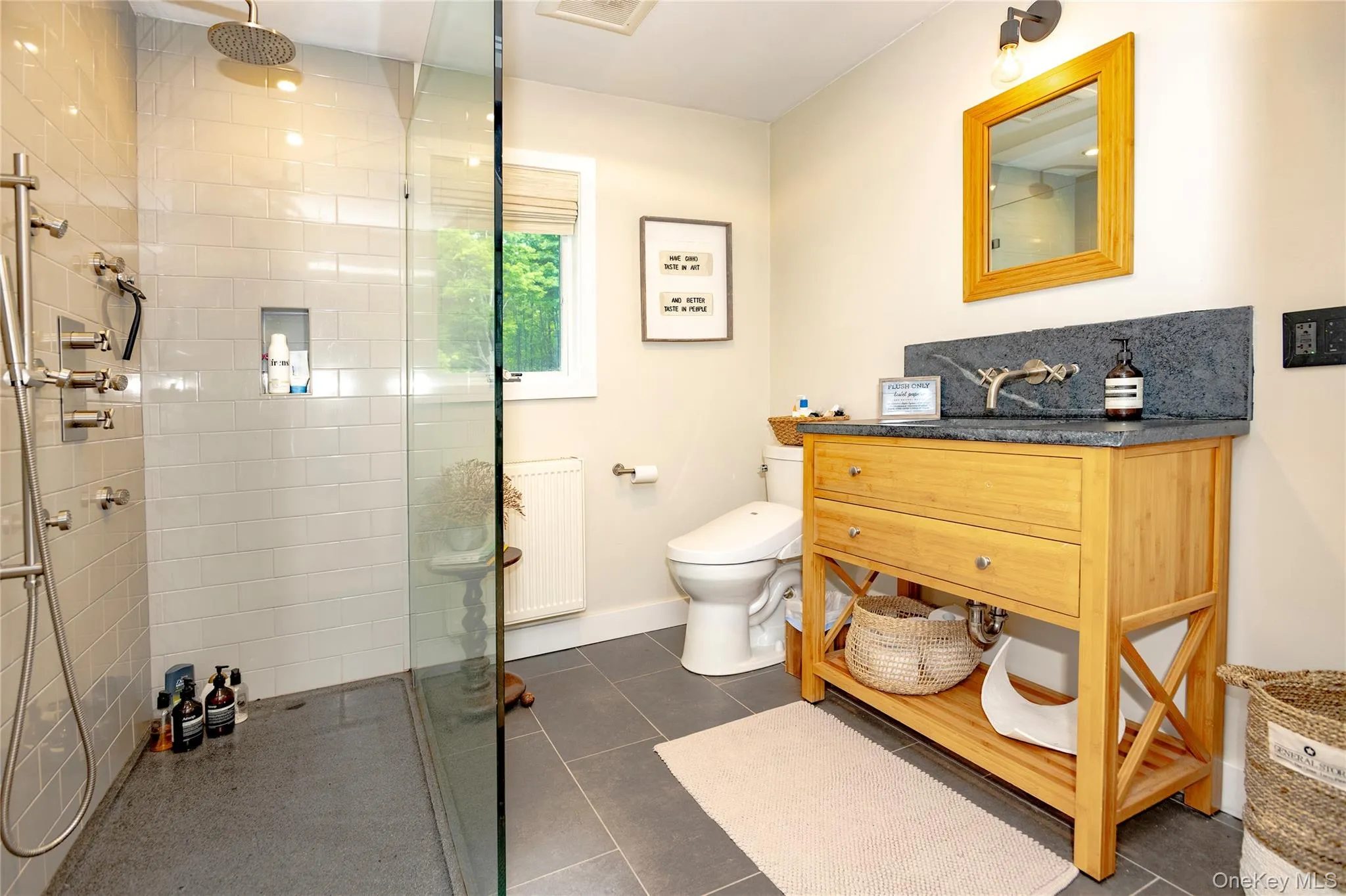 First floor bathroom with glass enclosed walk-in shower. First floor bathroom with glass enclosed walk-in shower.