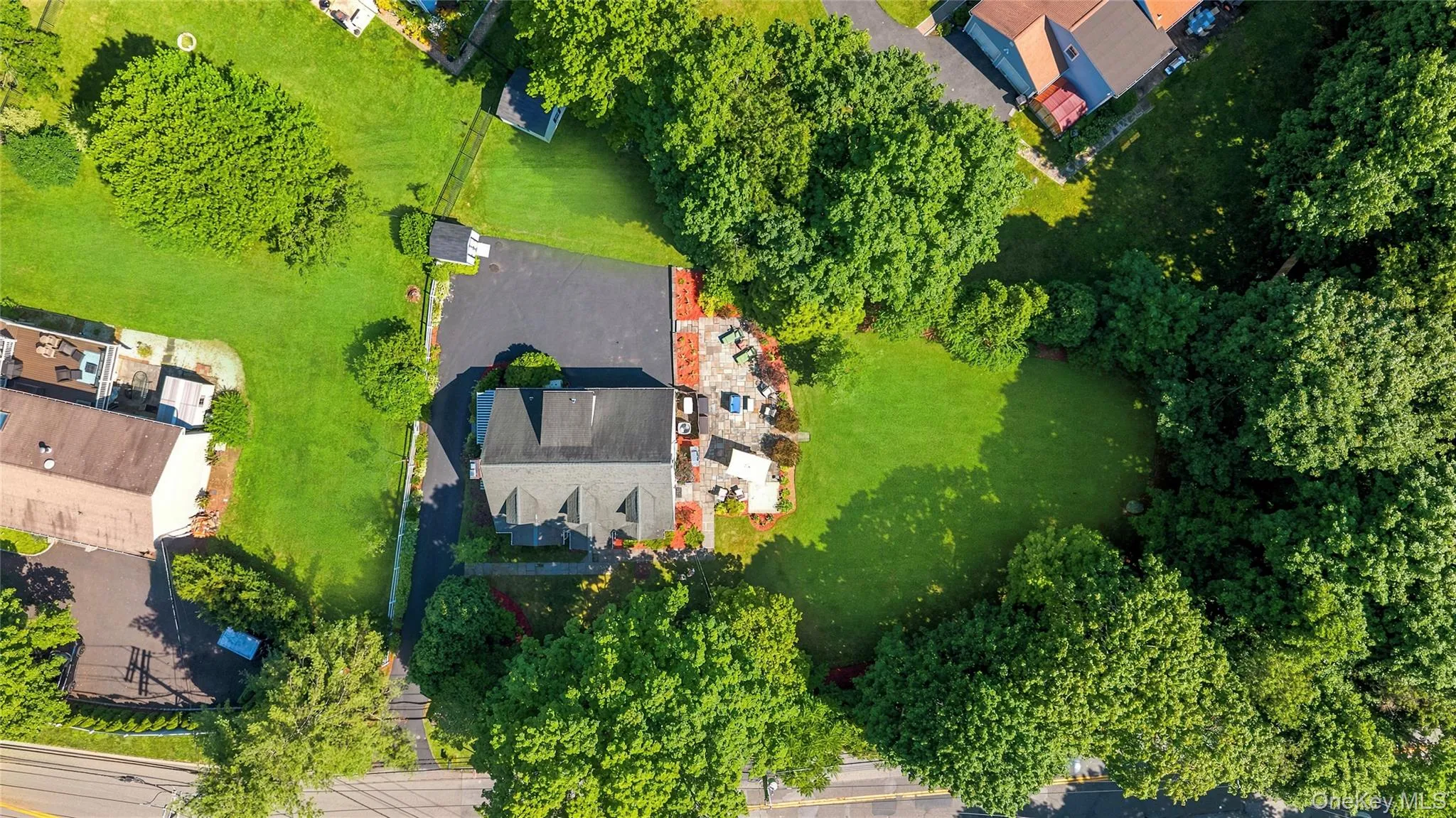 Aerial view of the two level yards and house and patio. Aerial view of the two level yards and house and patio.