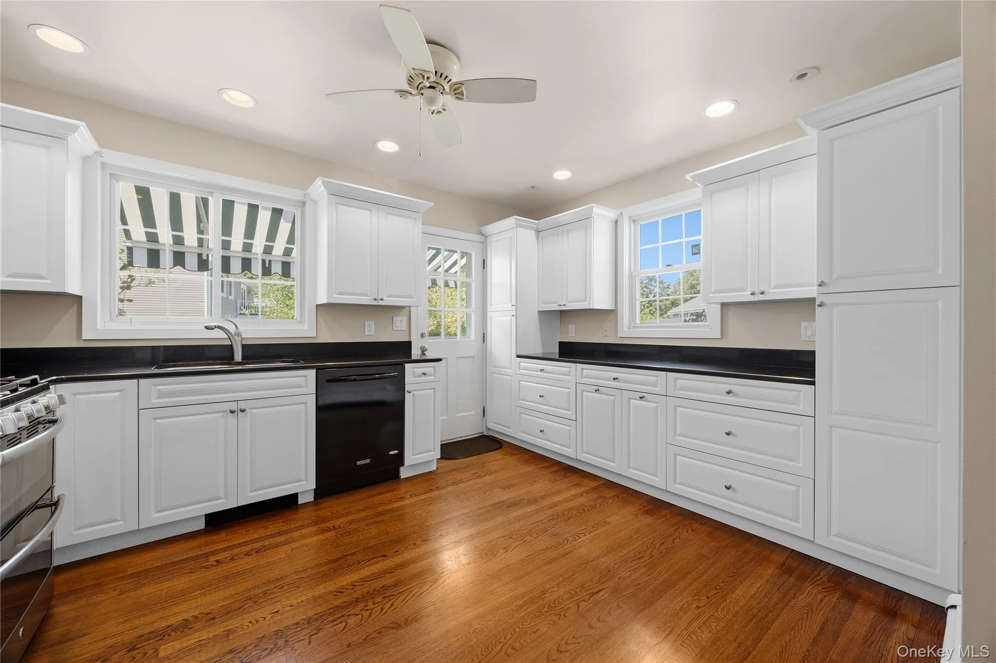 Pristine, updated Eat-in-Kitchen with side entry to driveway for easy grocery drop off Pristine, updated Eat-in-Kitchen with side entry to driveway for easy grocery drop off