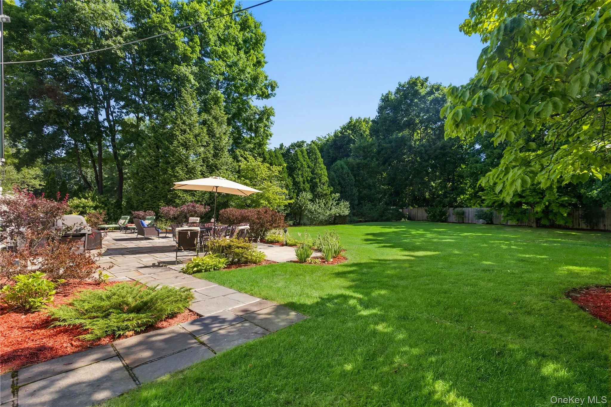 Fenced-in side level yard. Volleyball or soccer anyone? Fenced-in side level yard. Volleyball or soccer anyone?