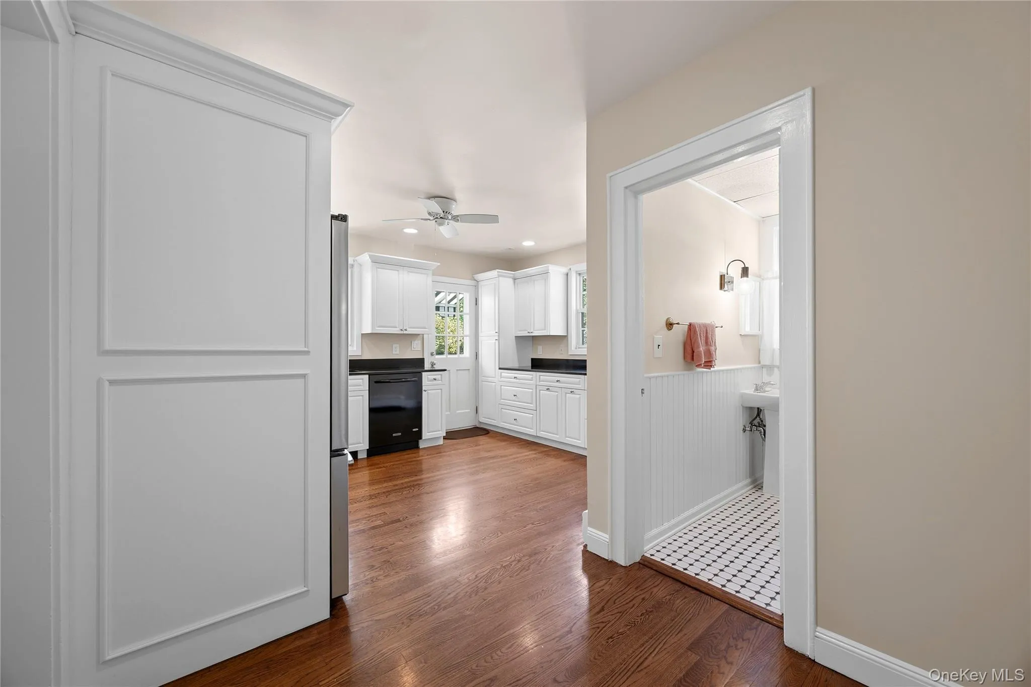 View as you walk from the living room to the Eat-in kitchen and pass the main floor full bathroom View as you walk from the living room to the Eat-in kitchen and pass the main floor full bathroom