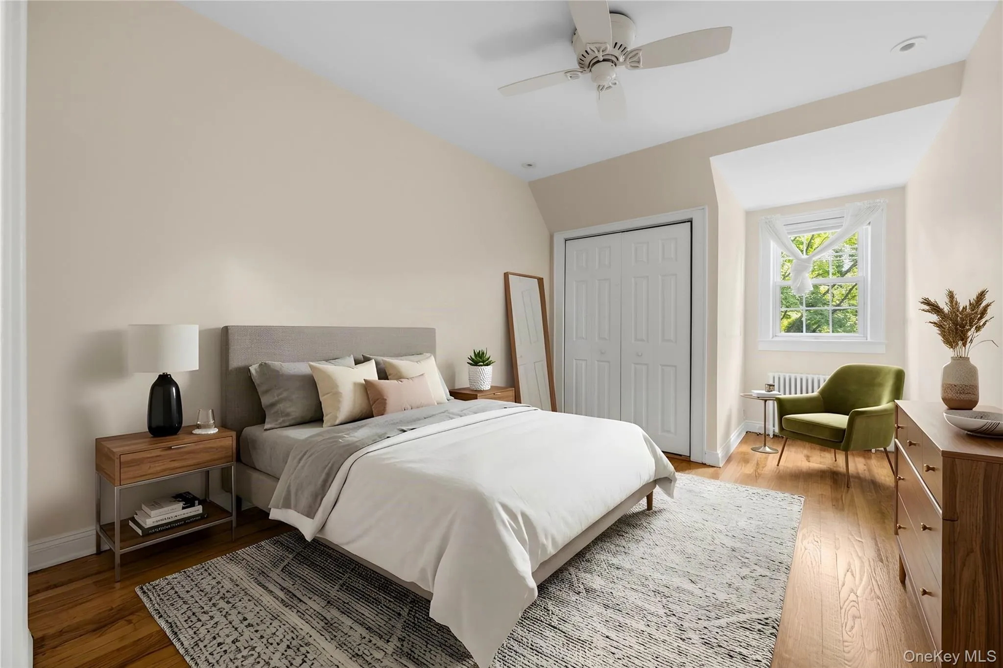 Virtually staged second bedroom with ceiling fan and closet Virtually staged second bedroom with ceiling fan and closet