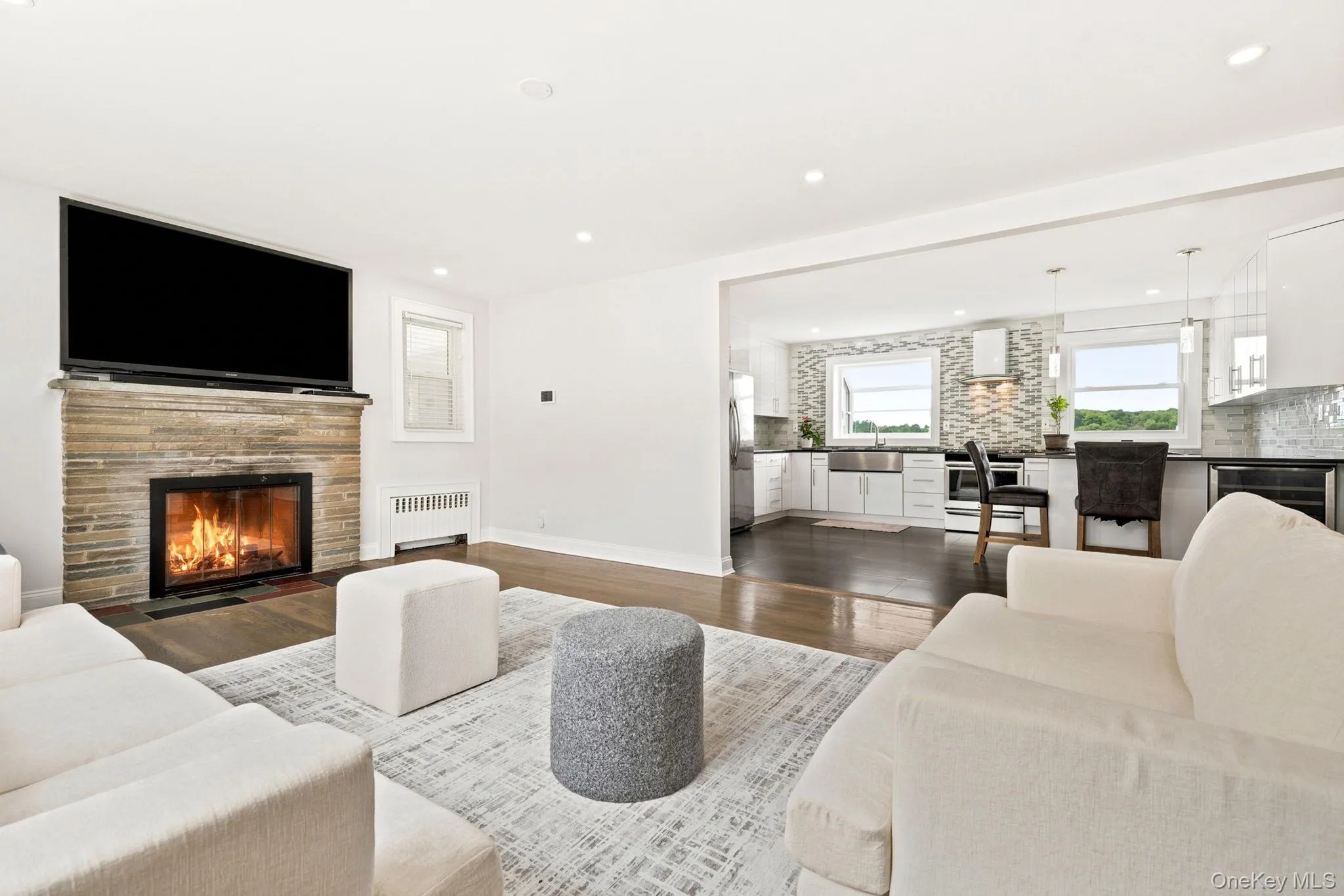 Gather around the warmth of a classic wood-burning fireplace. Gather around the warmth of a classic wood-burning fireplace.