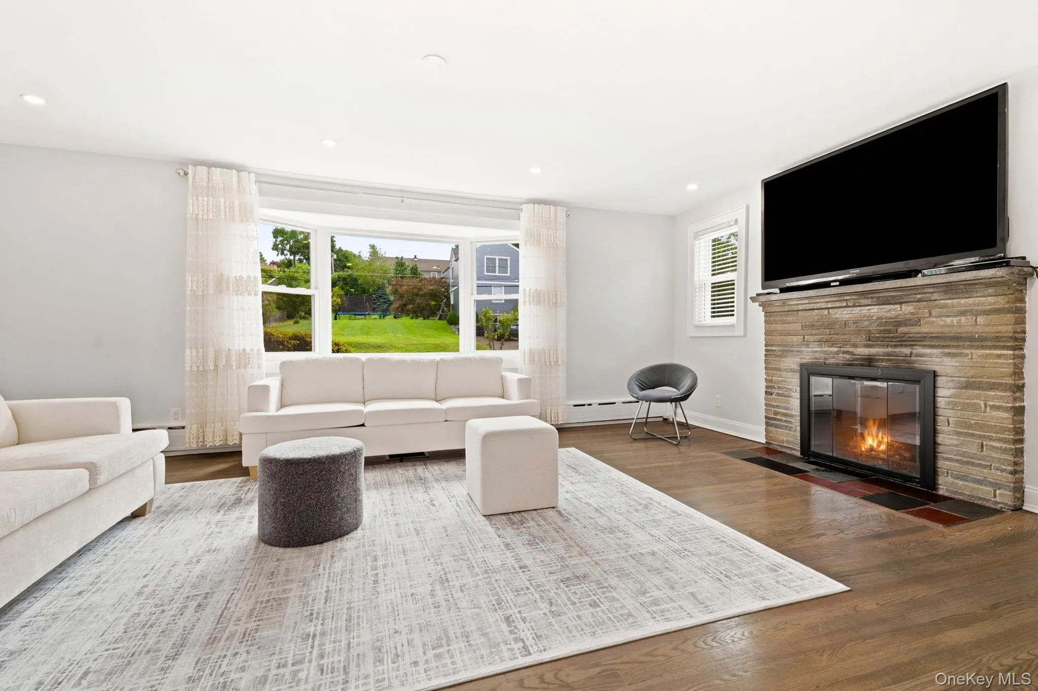 Natural light pours through oversized picture windows. Natural light pours through oversized picture windows.