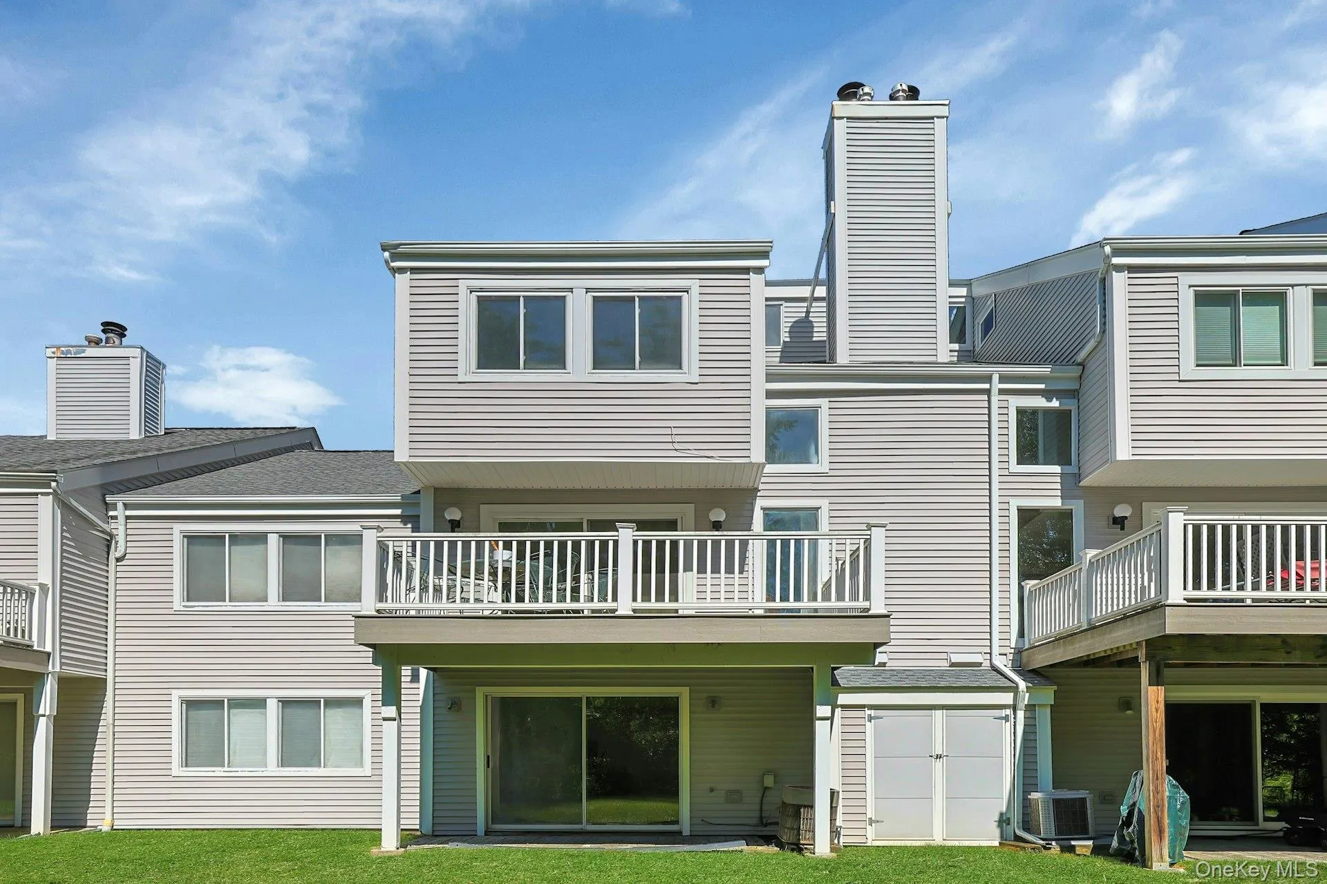 The rear of the unit offers both a deck and patio, perfect for relaxing or entertaining. The rear of the unit offers both a deck and patio, perfect for relaxing or entertaining.