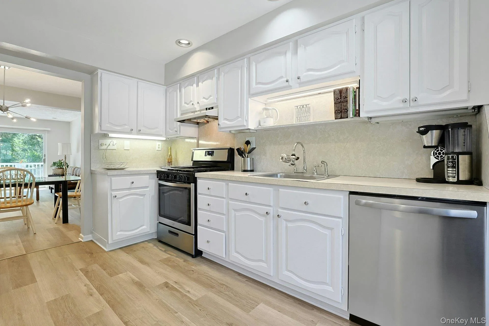 Spacious kitchen with stainless steel appliances and a dining area conveniently located just outside the kitchen. Spacious kitchen with stainless steel appliances and a dining area conveniently located just outside the kitchen.