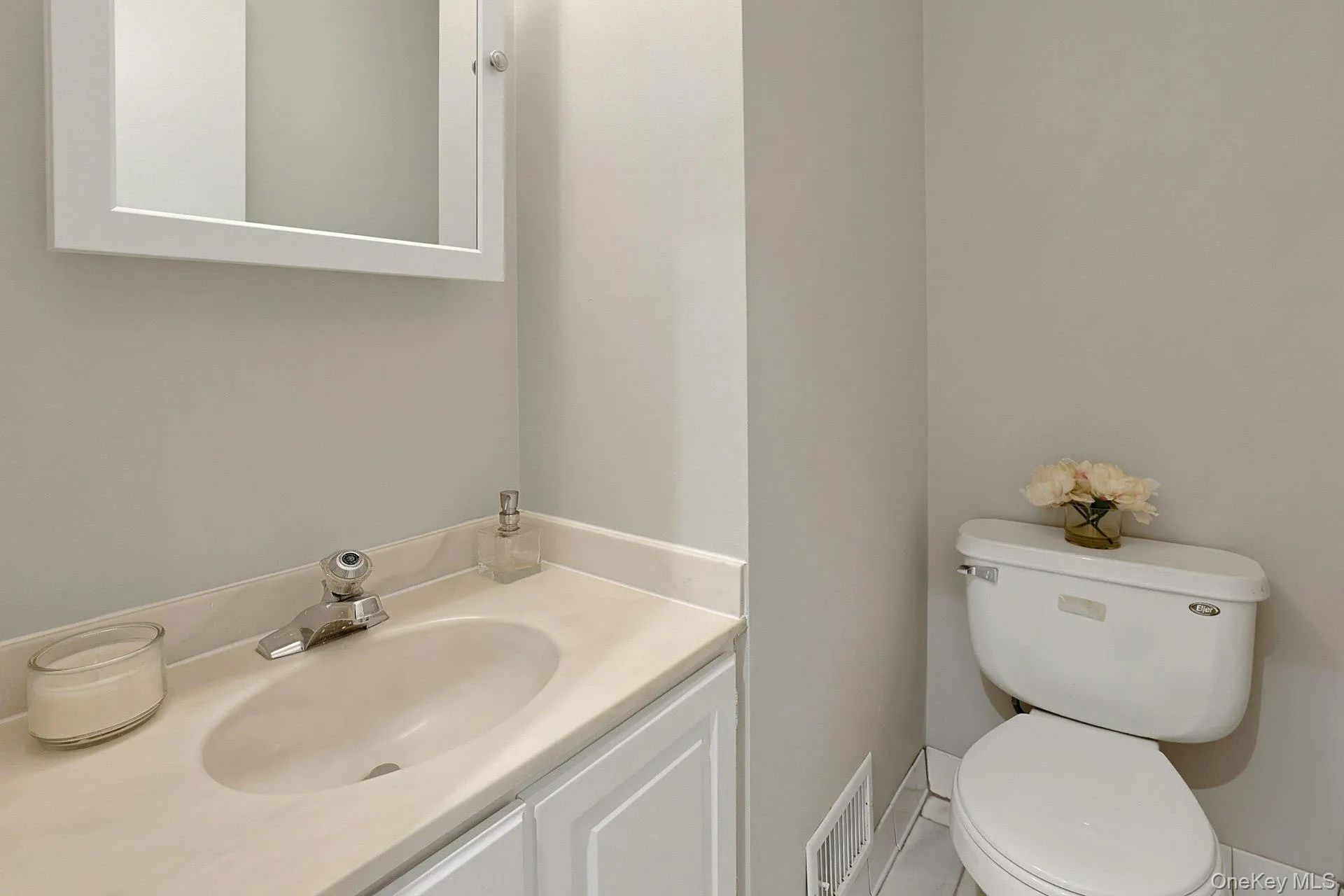 A conveniently located half bath completes the main floor. A conveniently located half bath completes the main floor.